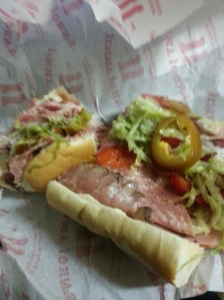 I've eaten at Jimmy Johns Many times before (I am a college student and it's perfect when coupled with alcohol...). But I had NEVER had the JJ Gargantuan.  genoa salami, sliced smoked ham, capicola, roast beef, turkey & provolone, jammed into one of our homemade French buns then smothered with onions, mayo, lettuce, tomato, & our homemade Italian dressing,..and I added bacon and hot peppers. Yes, continue to salivate. 